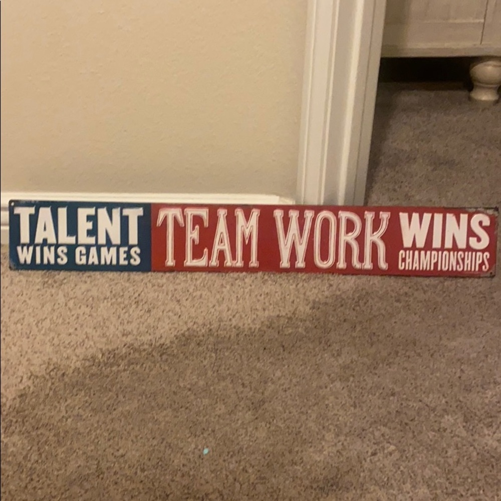 Metal team work sign